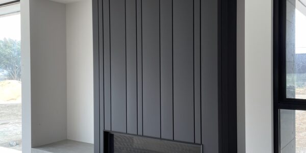 Colorbond Matt Monument Random Interlocking standing seam panels used for Fireplace surround