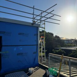 Construction works underway during a Fairhaven re-roofing project.